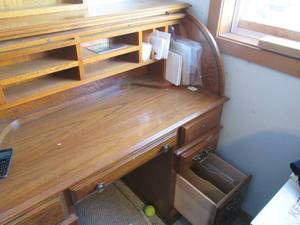 Contents of wooden roll top desk. T...