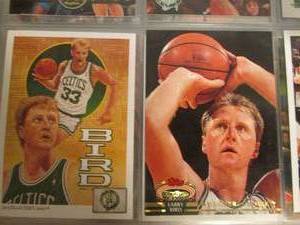 Larry Bird and other players in a m...