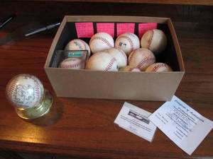 Box of baseballs most signed and ac...