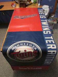 Twins hanging sign from the stadium...