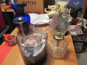 Vintage glassware and oil lamps wit...