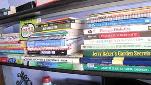 Shelf of assorted books, gardening,...