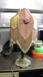 Vintage or antique lamp with ribbon...