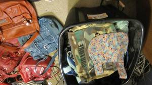 Large tote overflowing with purses,...
