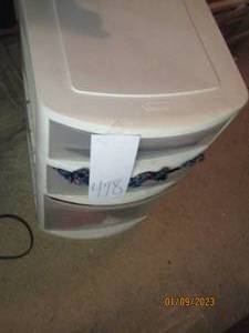 plastic 3-drawer organizer filled w...
