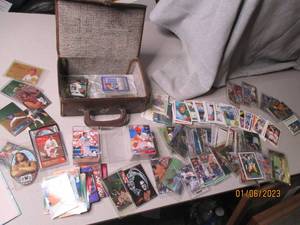 Assorted trading cards in a vintage...