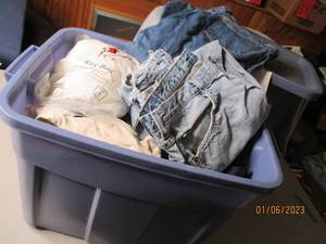 Covered tote filled with mens cloth...