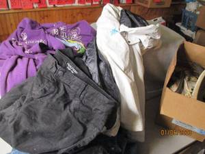 Covered tote full of clothes and sh...