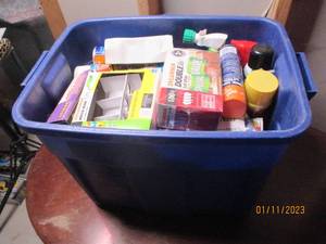 Covered tote jam packed with househ...