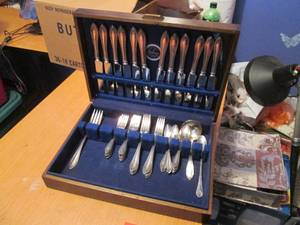 Vintage silverware set in wooden an...