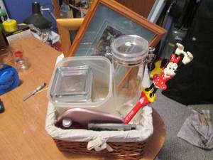 Wicker basket of decor items with p...