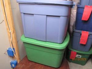 (2) covered totes with an assortmen...