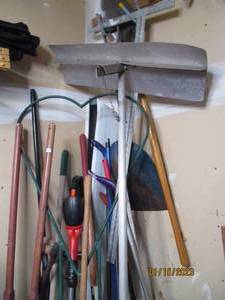 Garage lot of long handle yard tool...