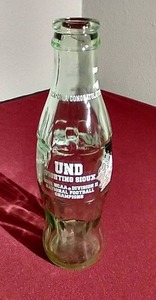 lot 5 image: 2001 UND Sioux Football Champions Coke Bottle