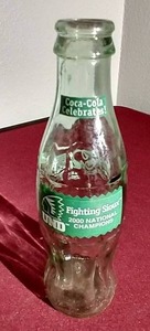 lot 124 image: 2000 UND Sioux Hockey Championship Coke Bottle