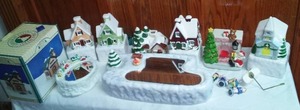 Christmas Village Houses And More. Some Wind-Up Music Boxes.