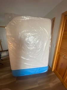 lot 67 image: New RV Foam mattress 53x79 with cut corner in sealed heavy plastic bag.