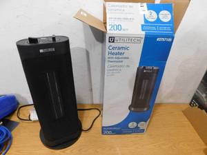 lot 83 image: Utilitech 1500-Watt Ceramic Tower Indoor Electric Space Heater with Thermostat