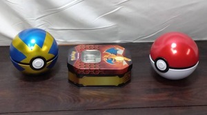 lot 80 image: Two Pokeballs And Card Tin