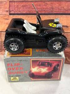 lot 5 image: Vintage Battery Operated Flip Over Buggy