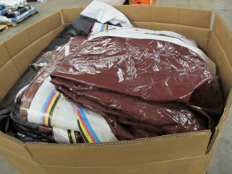 lot 17 image: Pallet of 16 Oversized Reused Billboard Tarps - 100 lbs per Tarp