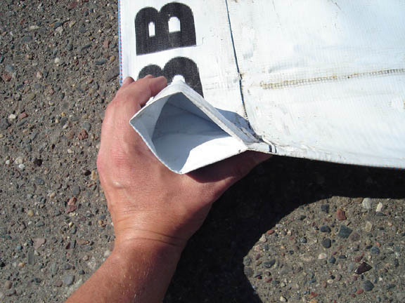 lot 114 image: 10 x 30 11 oz. Black Vinyl Tarp w Advertisement  Reused Billboard  13 mil Heavy Duty - A Grade
