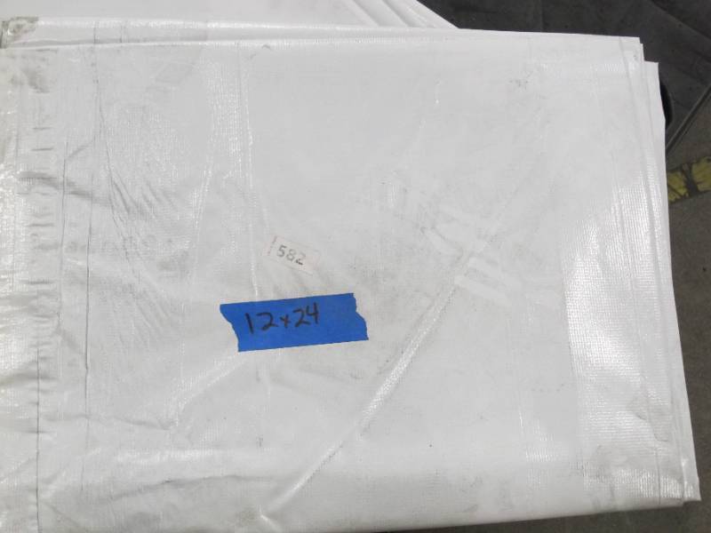 lot 137 image: NEW Vinyl Tarp - 12 x 24  Black  White Vinyl tarp - 9 oz. Lightweight Duty