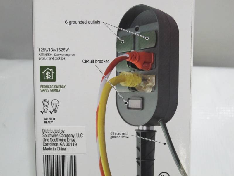 lot 918 image: Woods 59785WD 6-Outlet Yard Stake Timer with Photocell and Wireless Remote Control (Green)