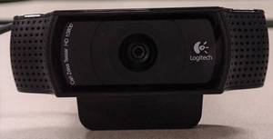 lot 29 image: Logitech C920 HD Pro Webcam  Carl Zeiss optics  1080p HD  78-degree field of view  Can be mounted on a LCD screen, notebook, tabletop or wall using attached clip or tripod using embedded thread
