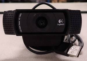 lot 30 image: Logitech C920 HD Pro Webcam  Carl Zeiss optics  1080p HD  78-degree field of view  Can be mounted on a LCD screen, notebook, tabletop or wall using attached clip or tripod using embedded thread