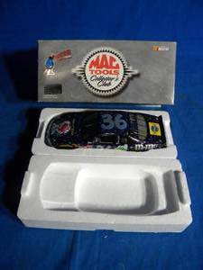lot 80 image: Vintage Action ERNIE IRVAN #36 M&Ms New Millennium Pontiac Grand Prix W Flakes 124 NIB