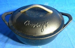 lot 149 image: Cravings by Chrissy Teigen 5 qt. Pre-Seasoned Cast Iron Dutch Oven