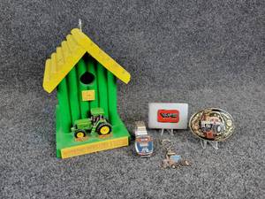 lot 54 image: White Farm Equipment Belt Buckles, Electronic Watch, Key Chain, and John Deere Bird House
