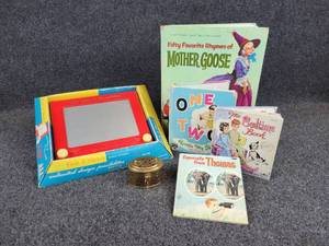 lot 65 image: Vintage Etch-A-Sketch in Original Box, Brass Cricket Box, 1963 Edition of Mother Goose Rhymes, and More