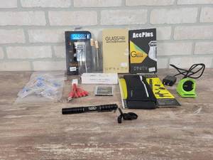 lot 105 image: Fraud Fighter UV Pen Light (Works), Screen Protectors, Samsung Battery, Puzzle Piece Pins and More