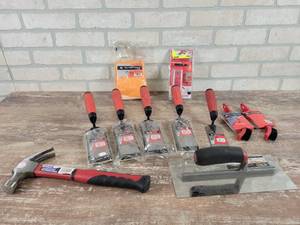 lot 244 image: (1) 6 Margin Trowel and (4) 6 Float Margin Trowels, (2) Grout Brushes, Grouting Gloves, Milwaukee Bit, 16oz Claw Hammer and Trowel