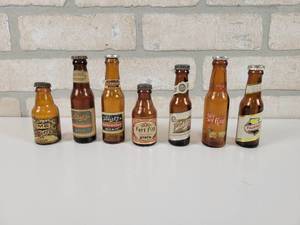 lot 43 image: (7) Mini Glass Beer Bottle Salt & Pepper Shakers - Tallest is Approx. 4.25