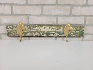 lot 88 image: Cast Iron Horse Coat Hangers on Antique Chipped Paint Board - Approx. 21.5 Long