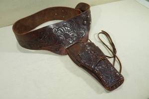 lot 79 image: Vintage Carved Dark Brown Leather Belt and Handgun Holster