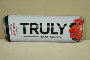 lot 127 image: Truly Hard Seltzer Embossed Metal Sign