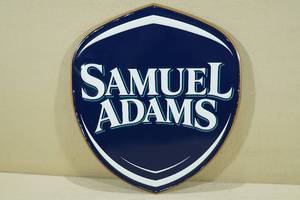 lot 131 image: Samuel Adams Beer Embossed Metal Sign