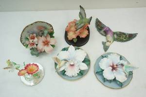 lot 11 image: humming bird  statues