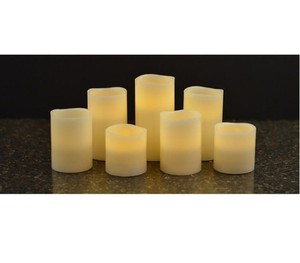 lot 599 image: NEW Members Mark 7-Piece Flameless Candle Pillar Set with Remote and Timer