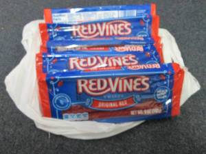 lot 266 image: 6- 5 oz pks Redvines Red Licorice...