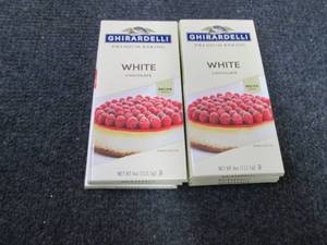 lot 277 image: 9- 4oz pks Ghiradelli White Chocola...
