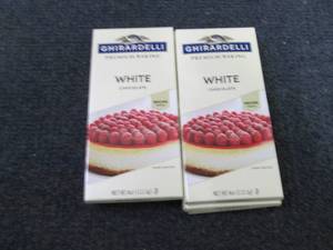 lot 279 image: 9- 4oz pks Ghiradelli White Chocola...