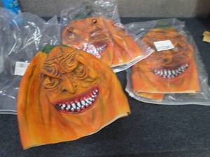 lot 26 image: 3 Creepy 2 Sided Pumpkin Masks...