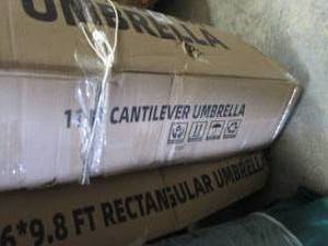 lot 216 image: 11 ft Blue Cantilever Umbrella...