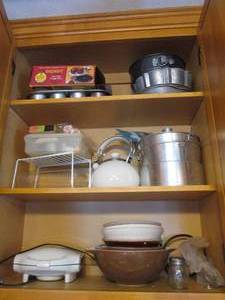 Items in cupboard, including waffle...