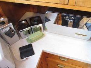 Items on countertop including vinta...